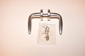 Entra Deurkrukken complete set RVS Matt geborsteld op rond rozet .